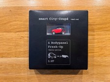 Modellauto smart City-Coupe in ROT & Bodypanel Fresh-up in GELB im Maßstab 1:87