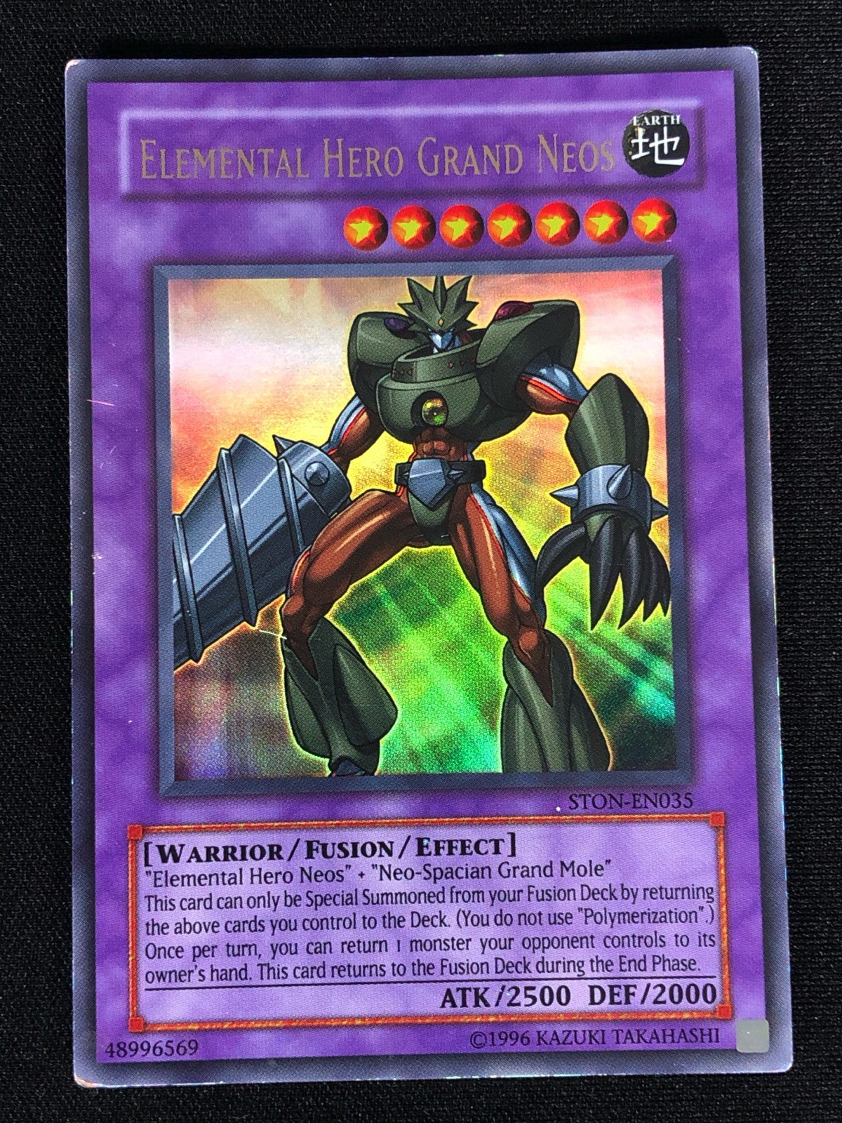 Elemental Hero Grand Neos STON-EN035 YuGiOh Strike of Neos trading card — raw and PSA graded price guide