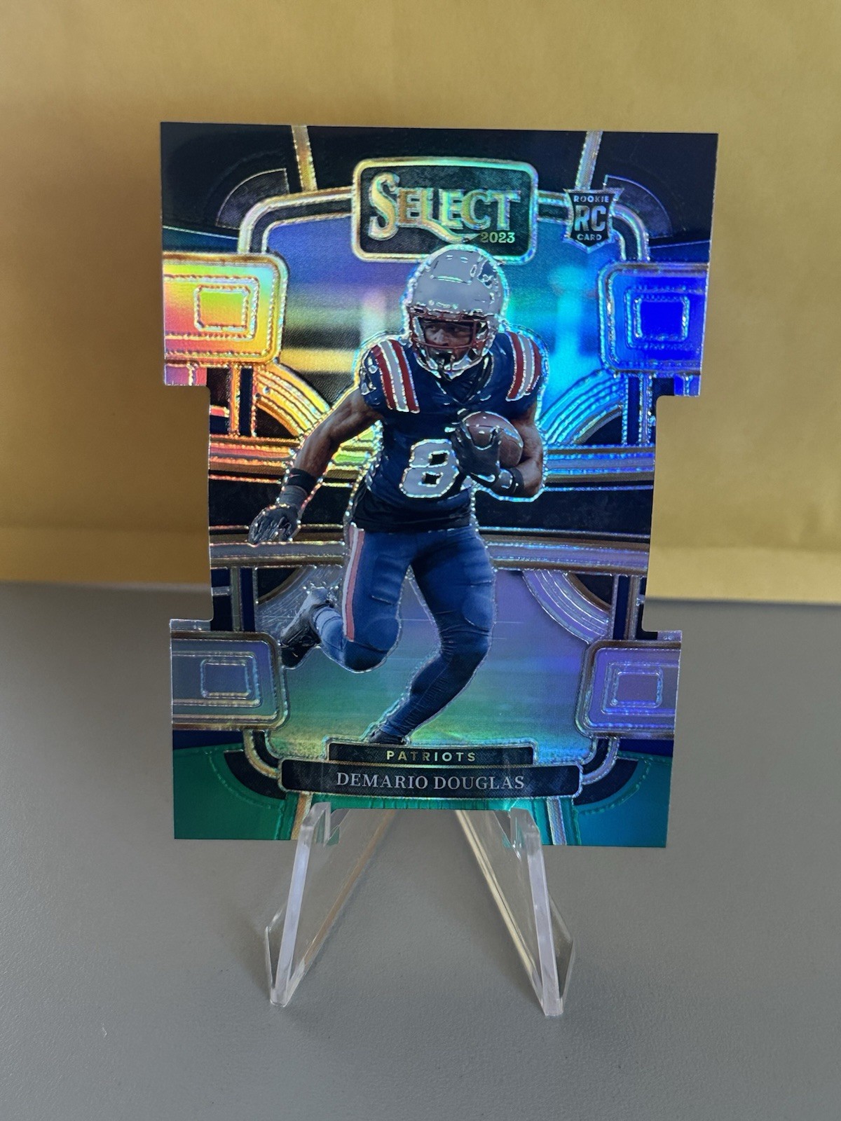 2023 Panini Select Concourse Demario Douglas #68 Black & Green Prizm Die-Cut RC