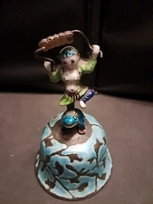 VINTAGE BELL DANCING FIGURE IN ETHNIC CLOTHS ON TOP OF FROG