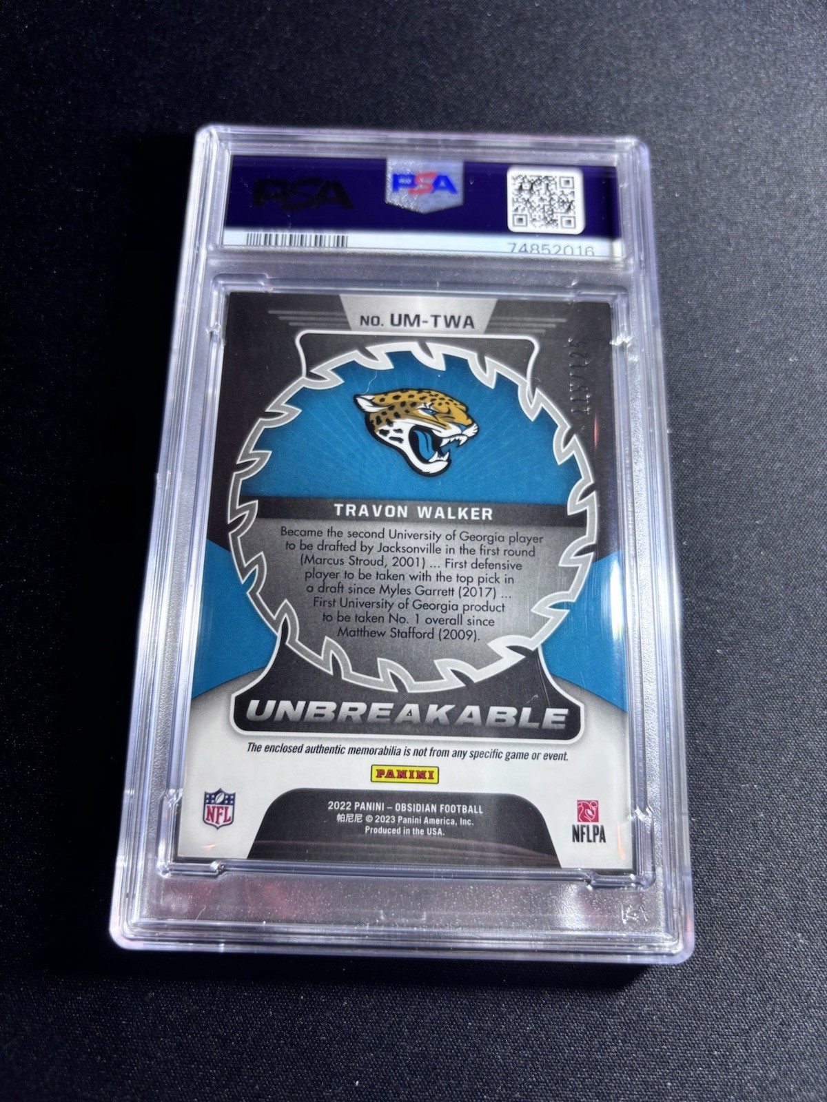 2022 Panini Obsidian Travon Walker Unbreakable Material /125 PSA 9 view 2