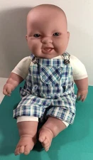 J C Toys Baby Soft Doll Two Teeth Life Like Eyes Blue No Hair  Shorts Overalls