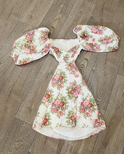 Dress like a princess in this Beautiful Floral Dress With Puffy Arms Open Back 