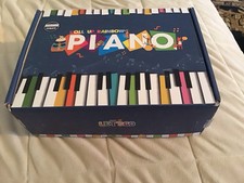 LETS GO ROLL UP RAINBOW PIANO NIB
