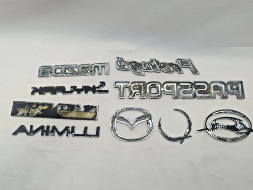 Lote emblema puerta GENUINO Mazda Skylark Protege Lumina Le Sabre - Imagen 4 de 4