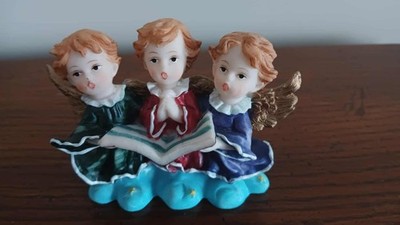 Three small singing angels colorful holiday figurine