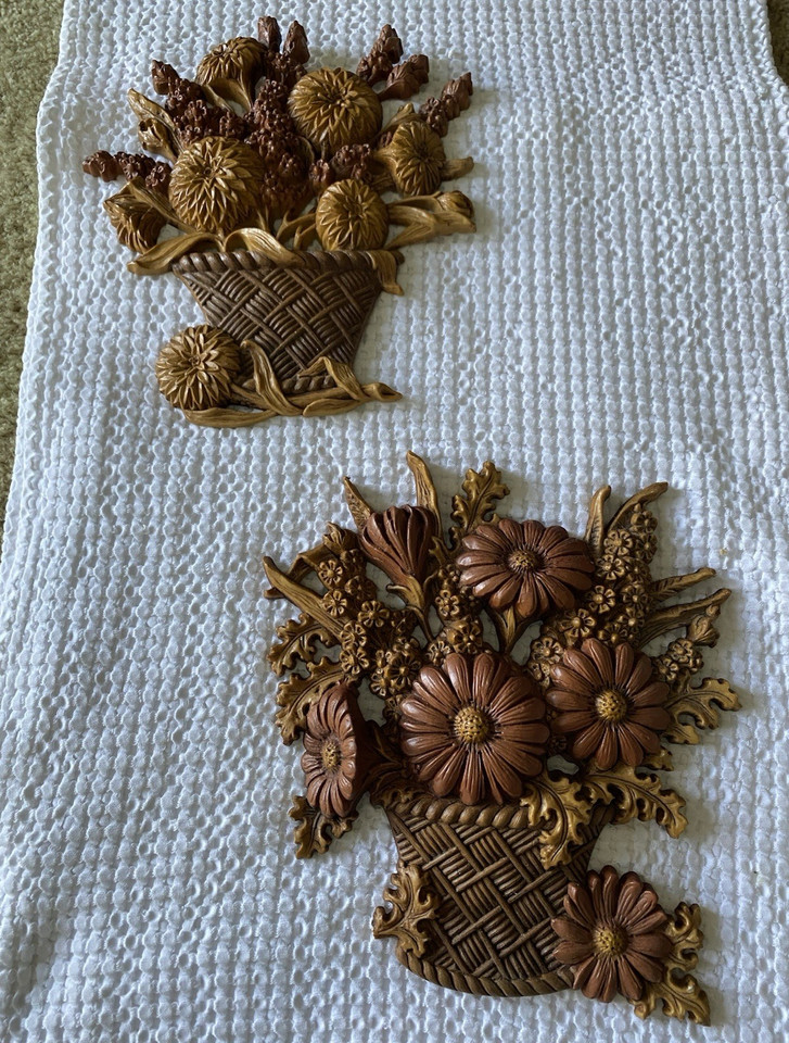 Mod 70s resin floral basket wall plaques in harvest brown — peak groovy-era kitsch that's genuinely hard to find.