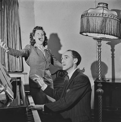 British singer songwriter Maurice Elwin plays a piano as part of a- 1943 Photo