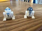 Lego Pair of R2-D2 Minifigures. One silver and blue top, one dark gray and navy