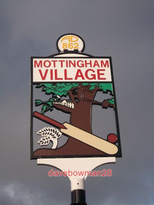 PHOTO  CLOSE-UP OF MOTTINGHAM VILLAGE SIGN  A CLOSE-UP OF.SHOWS A CRICKET BAT BE