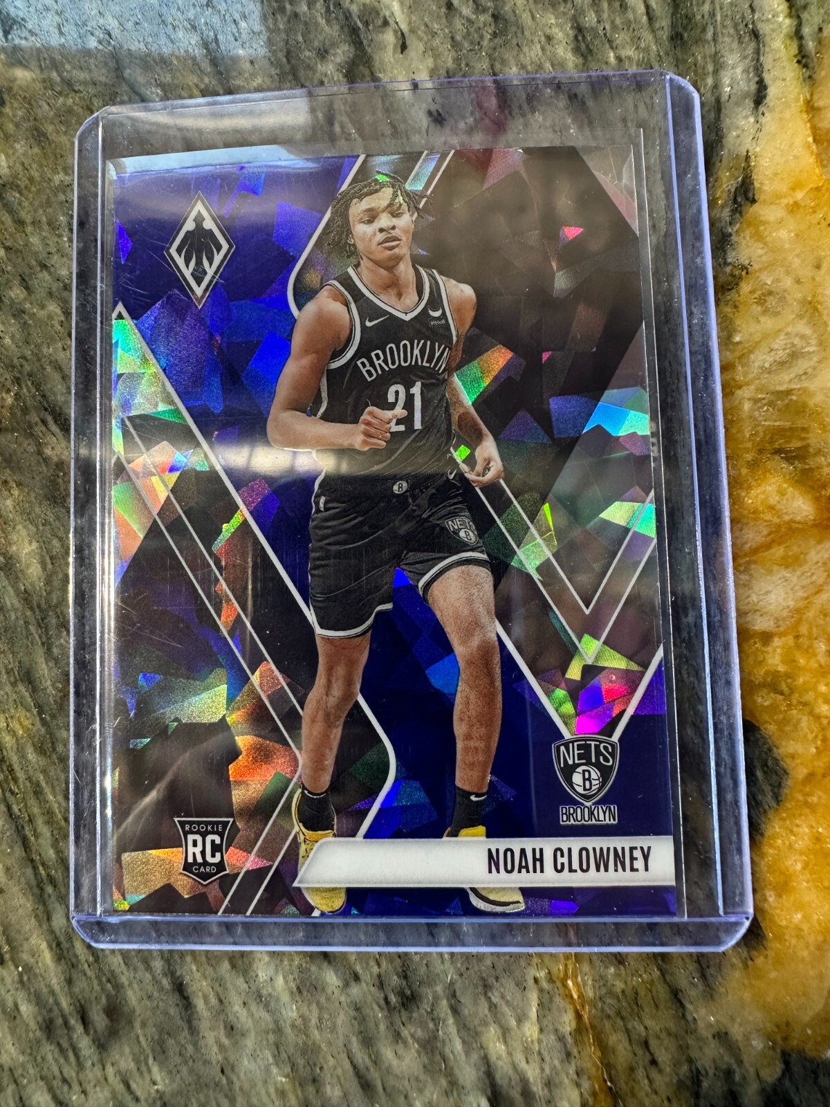 2023-24 Panini Phoenix - Rookies Noah Clowney #286 Blue Ice (RC)