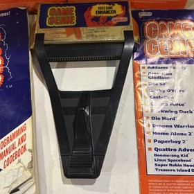 NES Game Genie Cartridge And 6 Manual Code Books
