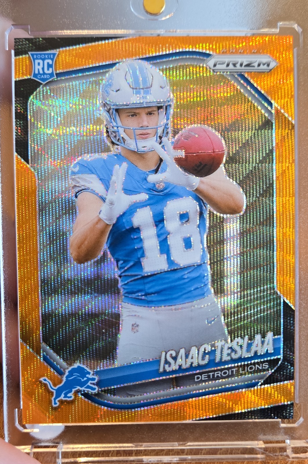 2025 Panini Prizm - Rookies Isaac Teslaa #316 Orange Wave Prizm /65 (RC)