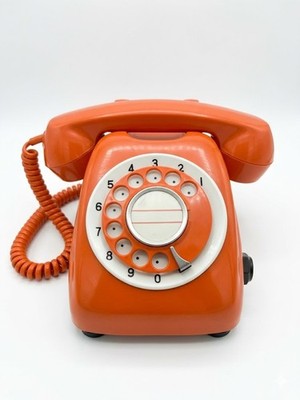 Vintage 1980 orange rotary phone, model 600-A. Fully functional