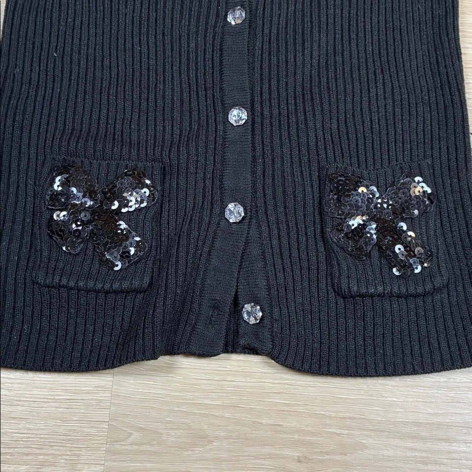 Cárdigan acanalado negro para niña Children's Place 5/6 con detalles de lazo de lentejuelas Foto 3 de 4