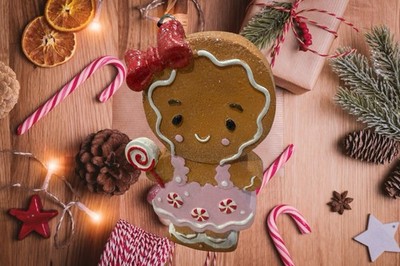 Gingerbread Girl With A Red Hair Bow And Lollie Pop