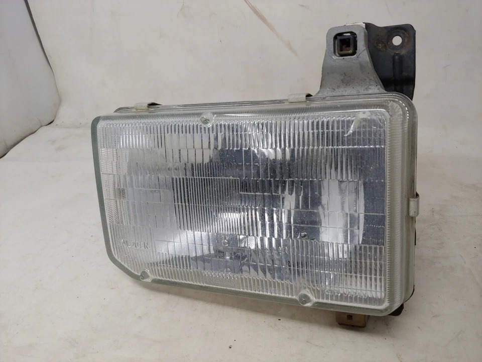 Faro lado izquierdo del conductor OEM 1987 88 89 90 91 92 93 94 95 Nissan Pathfinder Foto 3 de 4