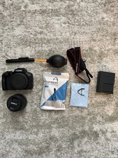 Canon EOS R100 Mirrorless Camera with RF‑S 18–45mm lens. Box and bag included