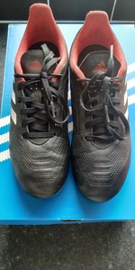 black and red predator football boots