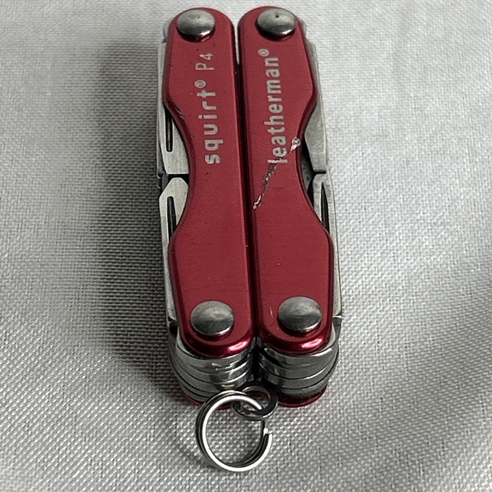 The rare RED variant of the iconic Leatherman Squirt P4 — a full-featured keychain multi-tool that's genuinely hard to find in this colorway.