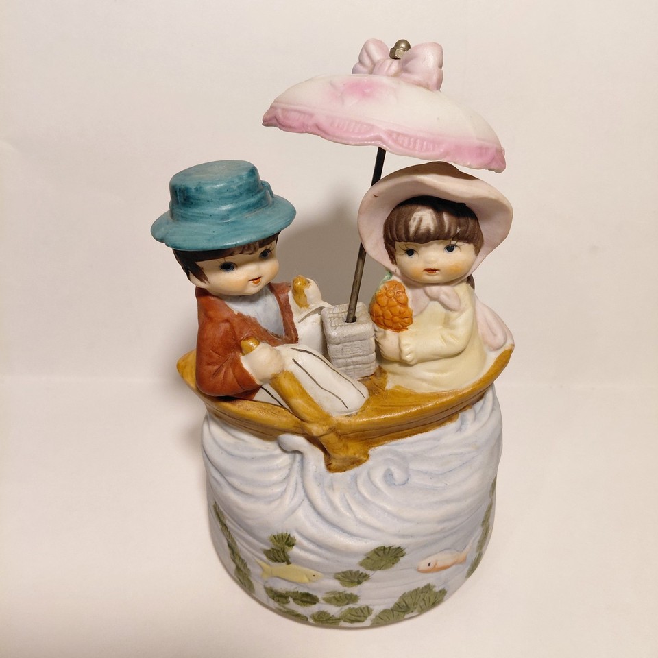 A porcelain revolving music box featuring Victorian boaters — charming, niche, and the kind of thing you stumble on once.