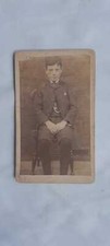 Antique CDV card real photo a boy sitting on a solid oak chair 1860s or 1870s