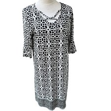 TACERA. NWT. Black & White Midi dress w/ Bell Sleeves.Crisscross straps on front