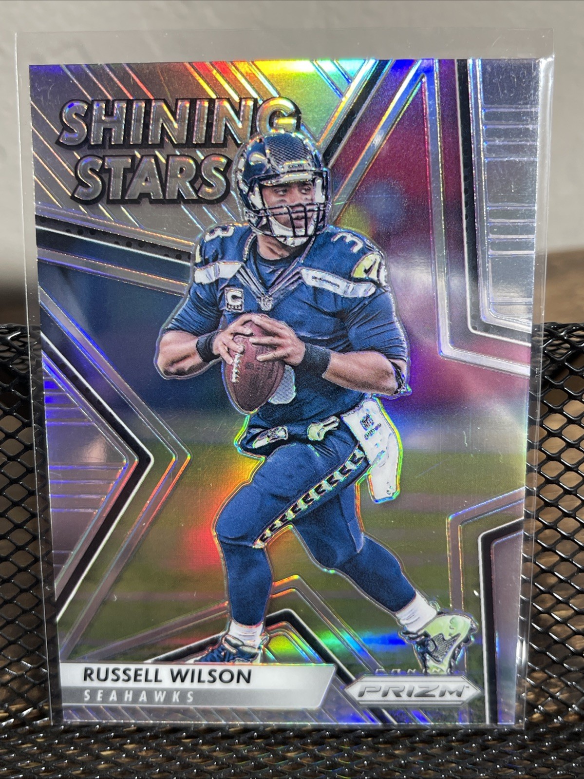 Russell Wilson #27 (Football Cards 2016 Panini Prizm Shining Stars) — is it worth grading?