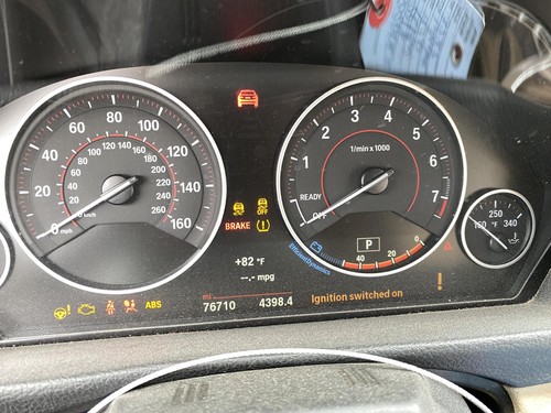 Black BMW 430I speedometer with 2018 model, showing 60 mph, brake light, and warning icons.