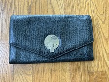 SMYTHSON OF BOND STREET Czarna skóra z chromowanymi akcentami Duży luksusowy portfel podróżny