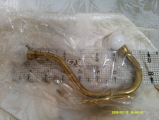 vintage 7" brass double coat hook with porcelian knobs, has screws