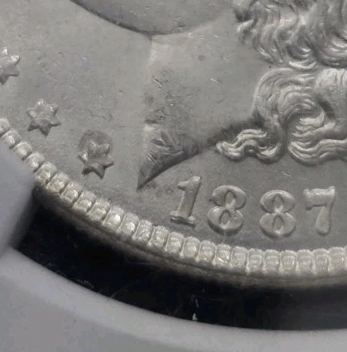 1887 Morgan Silver Dollar NGC MS 63 Doubling, Toned, Lamination Error PROOF LIKE - Image 3 of 4