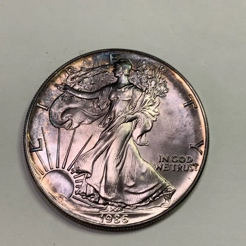 1986 ONE OUNCE AMERICAN .999 FINE SILVER EAGLE DOLLAR COIN TONED