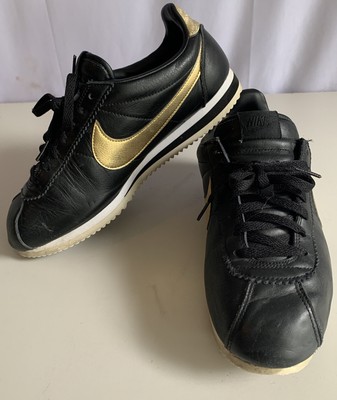 nike cortez black and gold womens