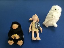 Harry Potter collectibles: Niffler, owl, elf, slippers, socks, pouch, or journal