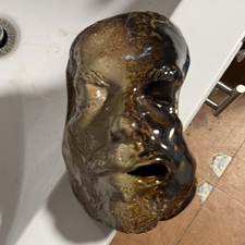 Glossy Brown Black Ceramic Figurine with Impressed Backstamp