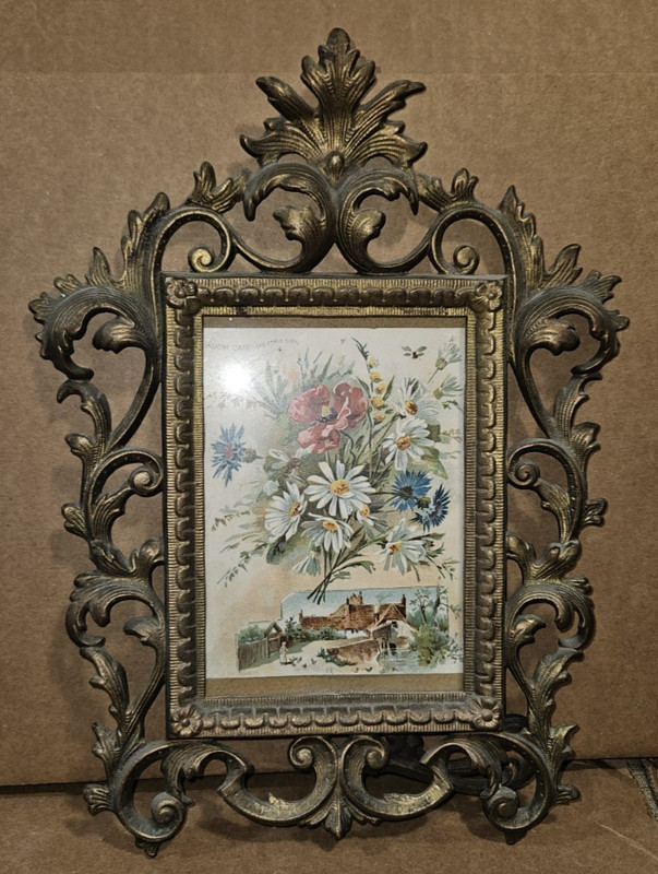 Antique brass picture frame features intricate leaf motifs in Art Nouveau
