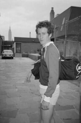 tennis player John McEnroe wearing a Sergio Tacchini tracksuit top