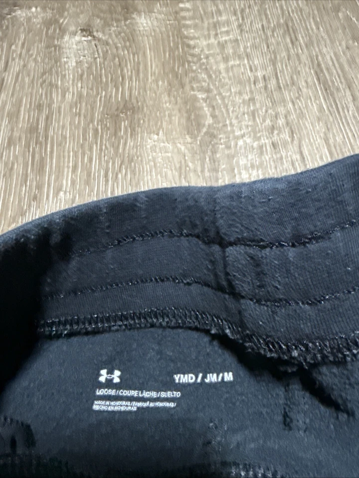 Pantalones deportivos Under Armour niñas jóvenes medianos negros calce holgado Foto 3 de 4