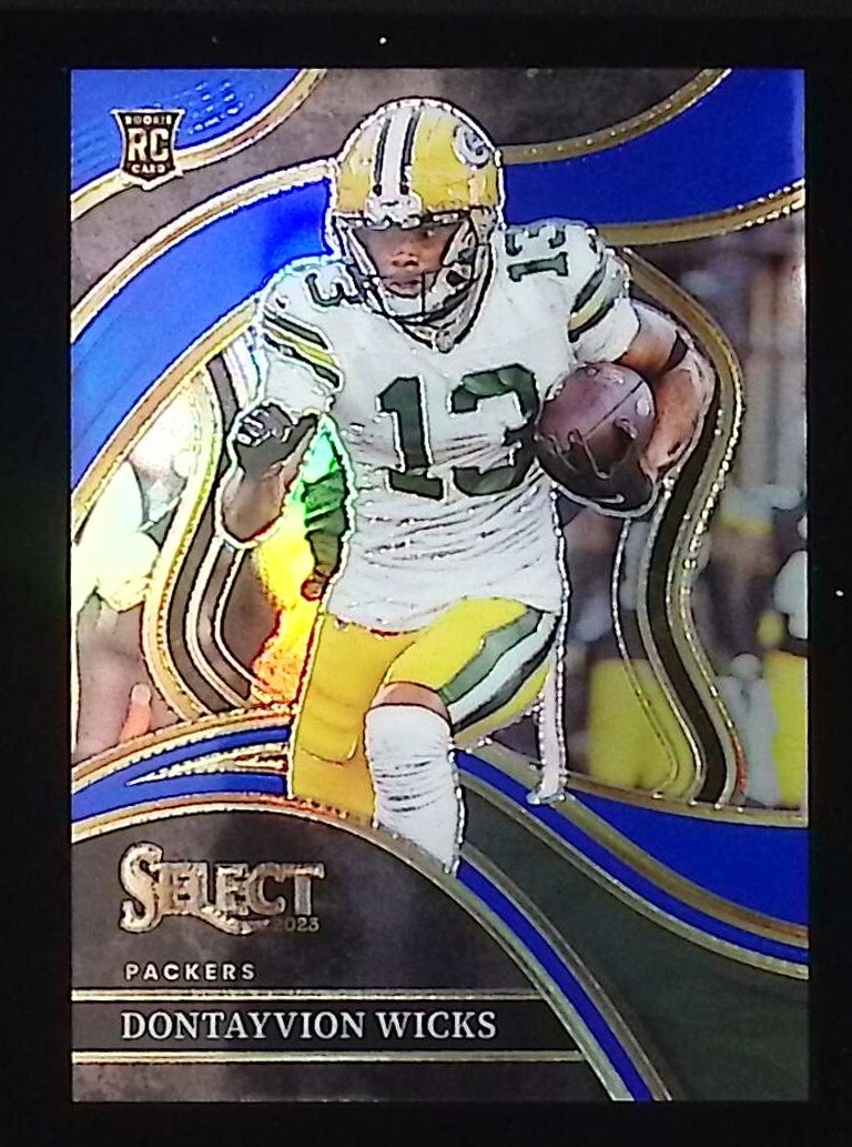 2023 Select Football Dontayvion Wicks Club Level Blue Prizm 32/99 RC Packers