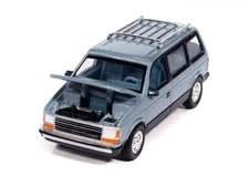 Auto World  1987 Plymouth Voyager Ice Blue 1:64 Die-cast