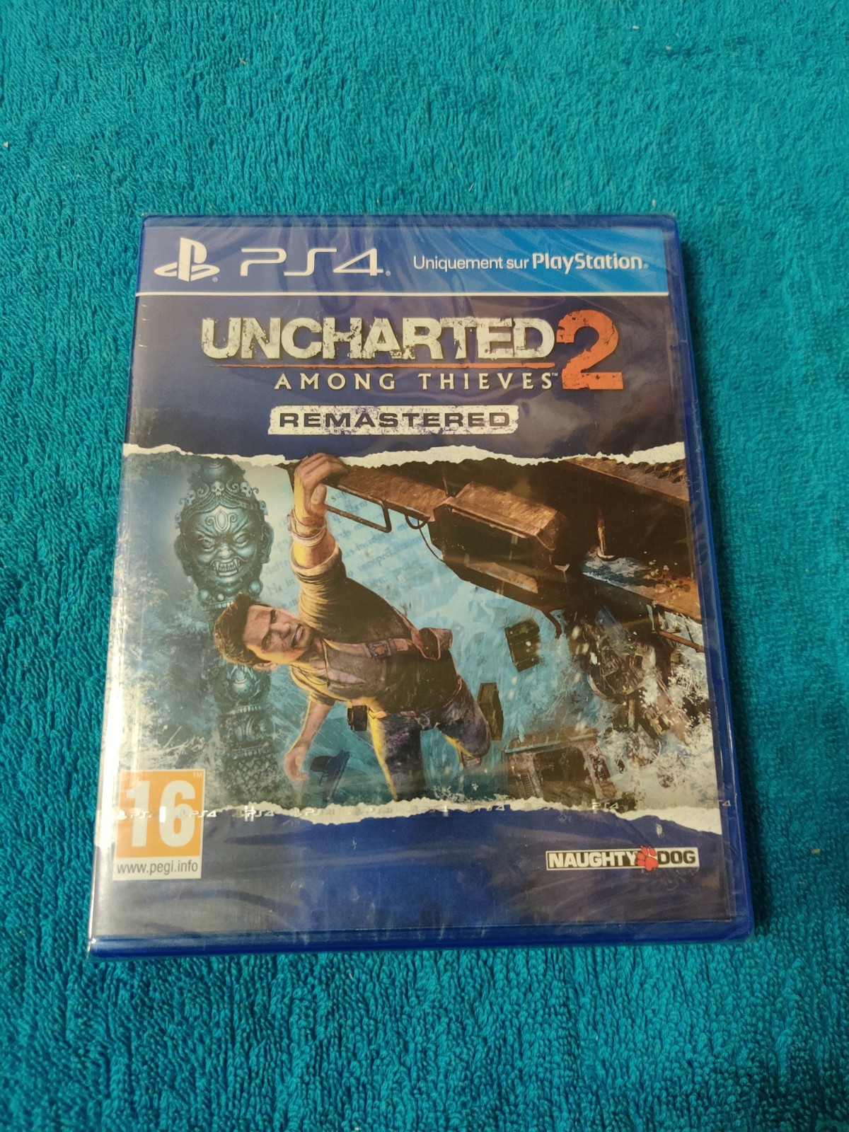 PS4 UNCHARTED 2 AMONG THIEVES REMASTERED, NEUF SOUS BLISTER, VERSION FR