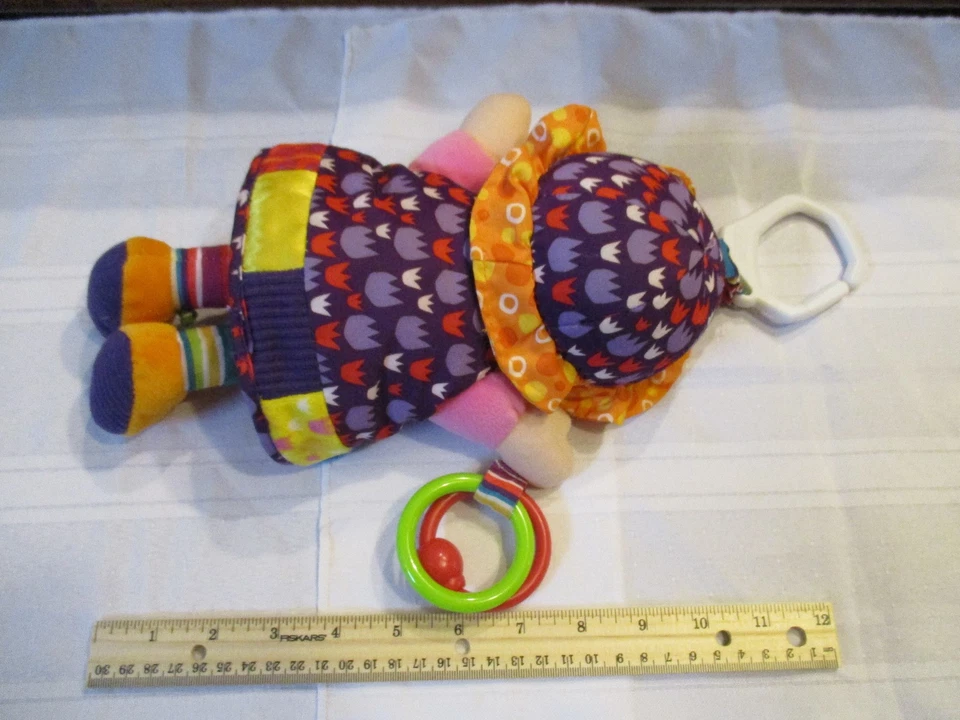 Juguete de peluche colgante Lamaze My Friend First Baby Doll Sonajero asiento de coche púrpura tulipán  Foto 2 de 4