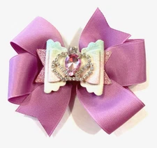 Beautiful lavender bow with additional faux leather bow with jeweled crown.
