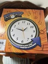 Funny Black Backwards Wall Clock (9") Large Numbers. Runs Counterclockwise and R