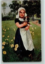 12085527 - sign Susemihl - Hollandkind in Tracht mit einem kleinen Welpen Hund