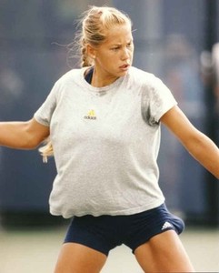 Anna Kournikova Playing Tennis wearing a Gray Shirt and ...