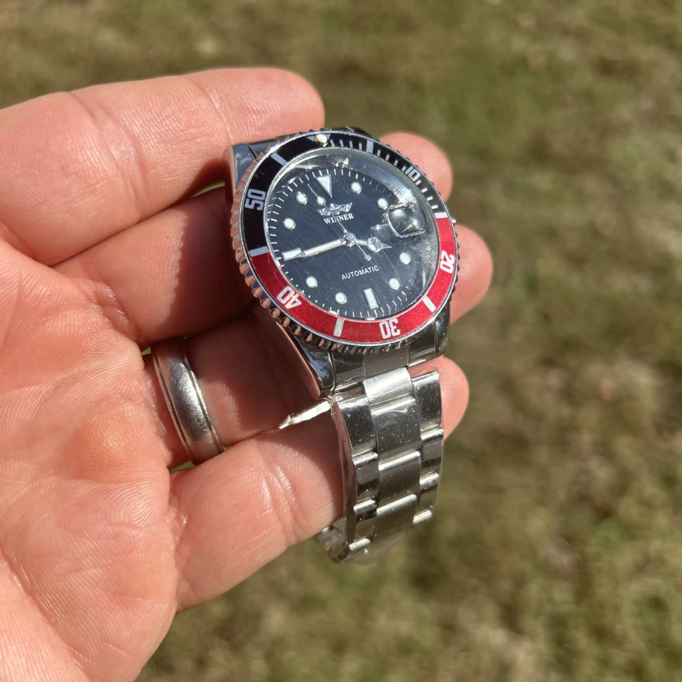 Reloj mecánico automático Winner de acero inoxidable para hombre - Bisel de Coca-Cola impermeable Foto 2 de 4