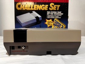 Nintendo NES Challenge Set Console With 12 Games And Cleaning Kit.