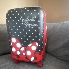 Maleta rígida giratoria a lunares American Tourister Minnie Mouse roja